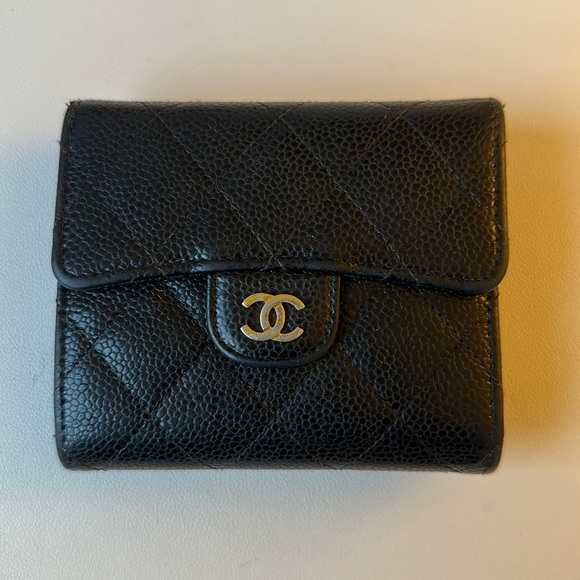 Classic black Chanel flap wallet in caviar leather